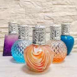 Lampe Catalytique Orange Waves (100ml). Assainit l'environnement et élimine mauvaises odeurs et impuretés de air sans les masquer