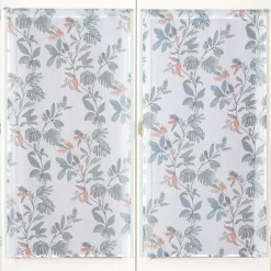 Paire de voilages imprimés bleu avec finition passe-tringle 60x160cm.