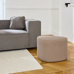 tabouret. pouf en forme de galet en tissu greige. TAO L 60 x P 44 x H 40cm