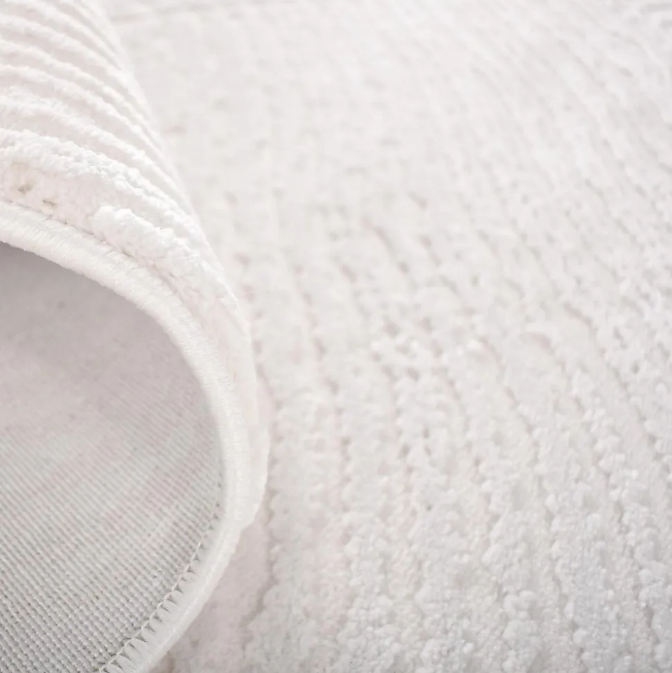 Tapis salon et chambre tissé motif faux uni DAMCIA, crème