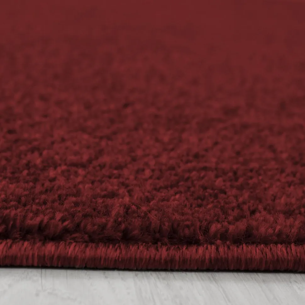 Tapis salon et chambre tissé motif uni SOULA, rouge